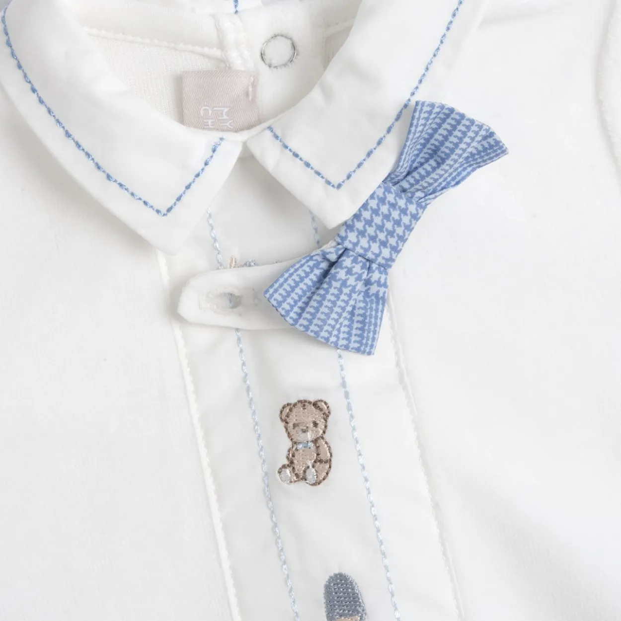 Completo maglia e pantaloni con piedini