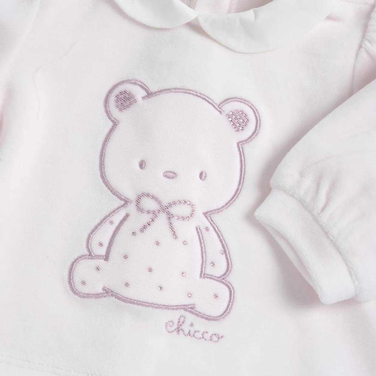 Completo maglia e pantaloni con piedini