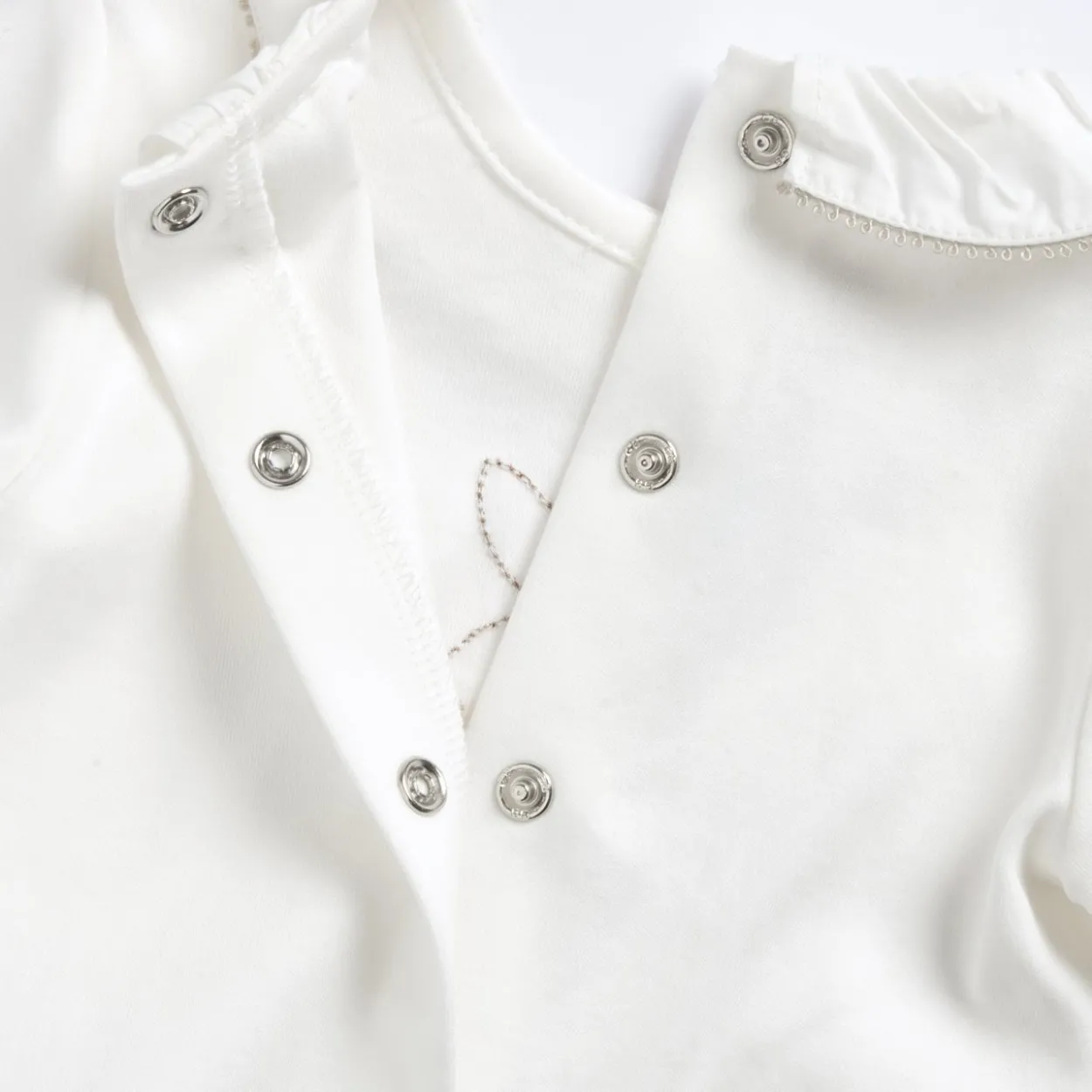 Completo maglia e pantaloni con piedini