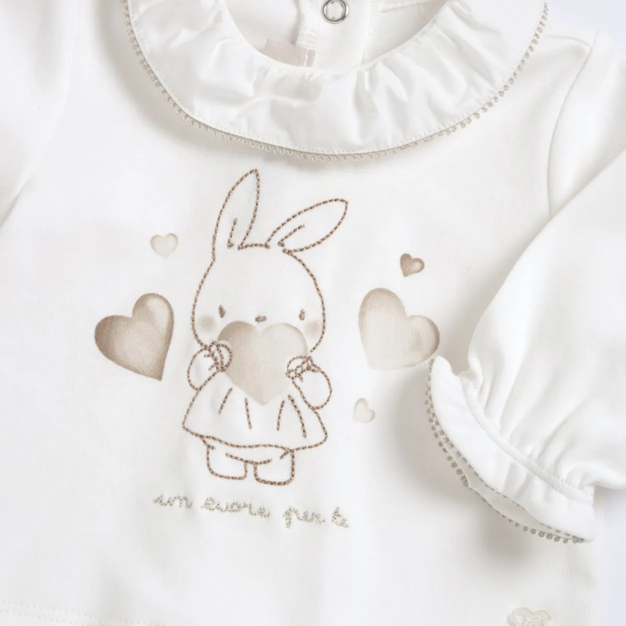Completo maglia e pantaloni con piedini