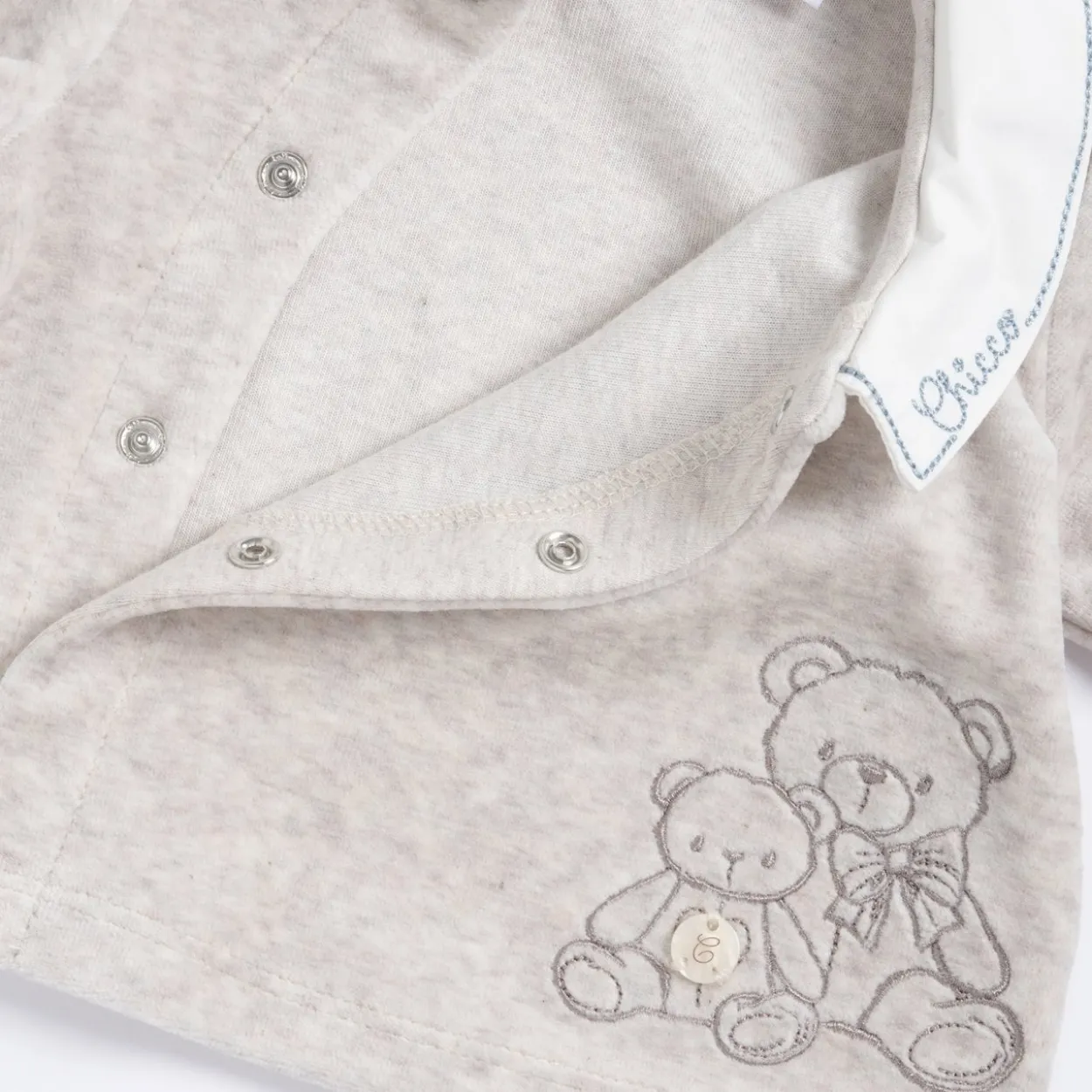 Completo maglia e pantaloni con piedini