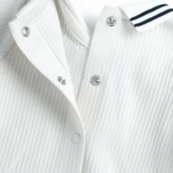 Completo maglia e pantaloni con piedini
