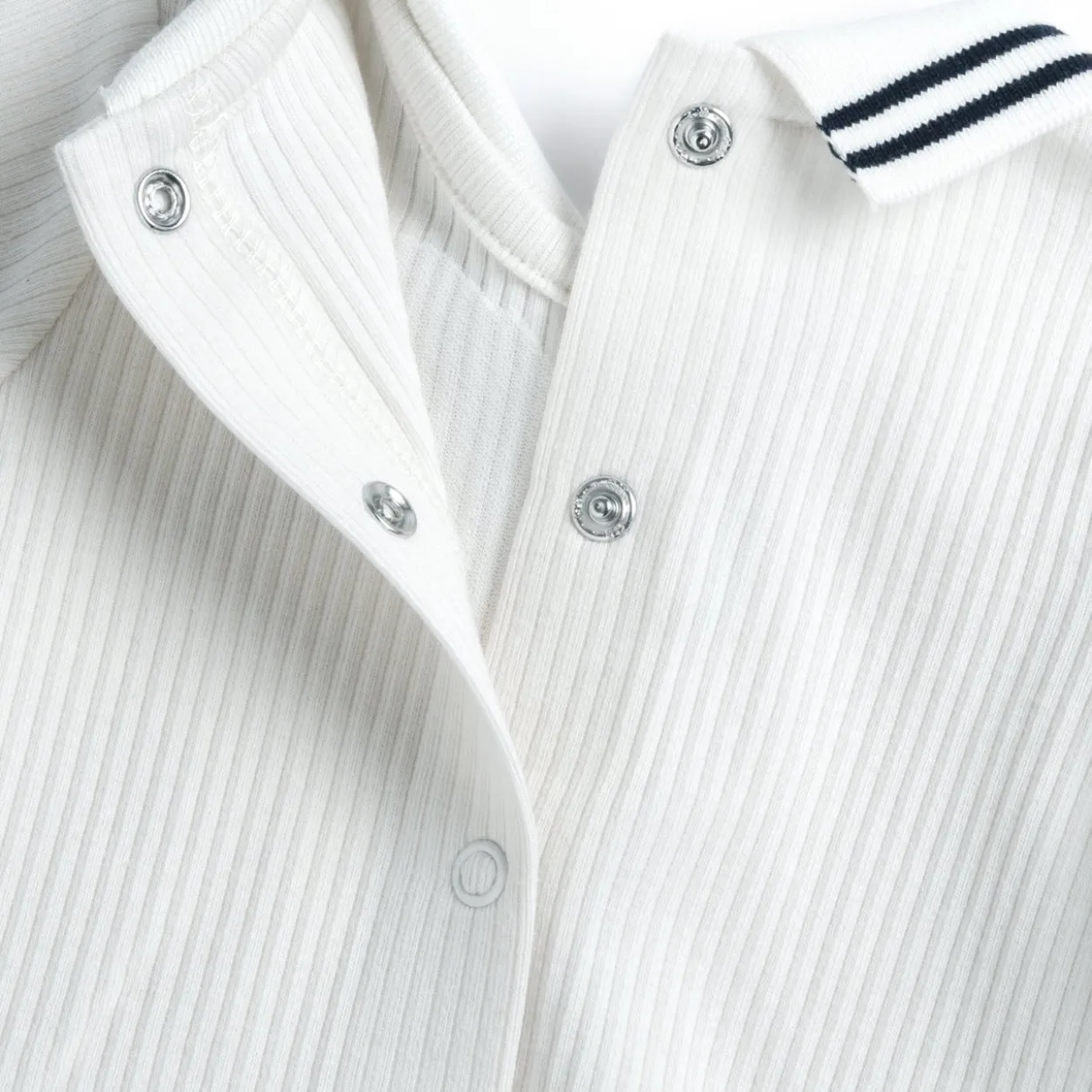 Completo maglia e pantaloni con piedini